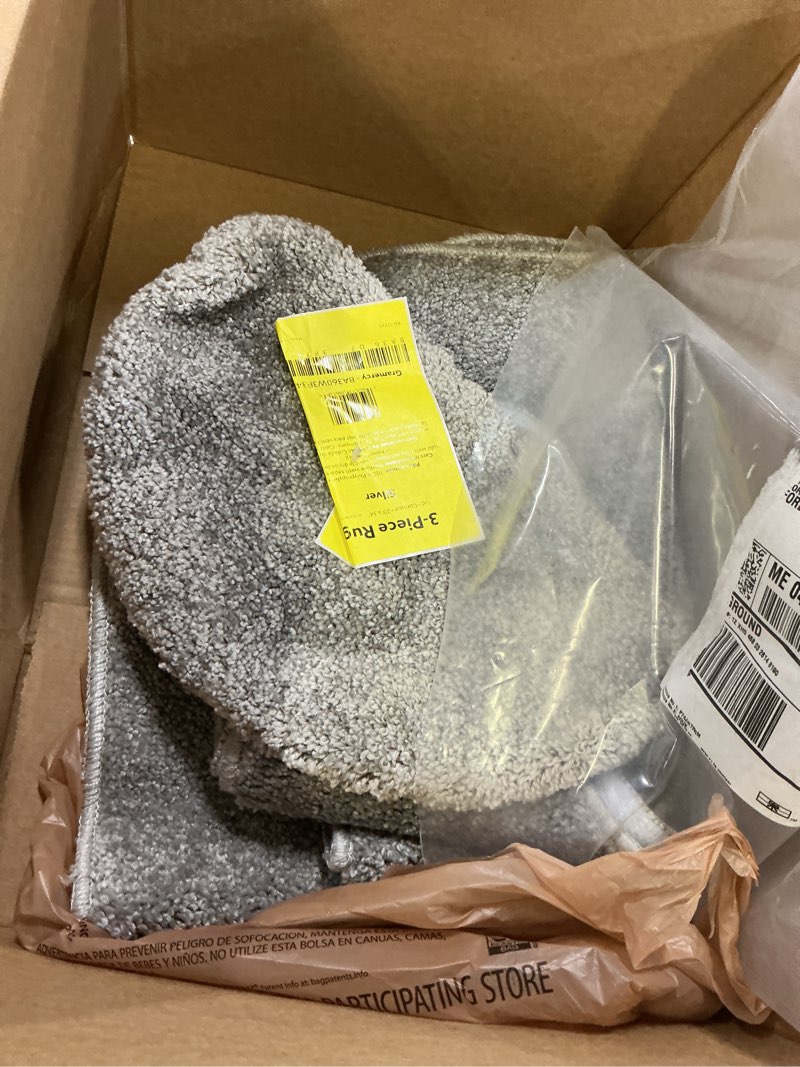 Condition photo showing As Is for garland rug gramercy washable bath rug – soft, plush, absorbent, quick-dry, durable, 3 piece rug set (toilet lid cover, contour rug, 20" x34' bath rugs), silver silver 3 piece rug set (lid, contour, 20"x34")