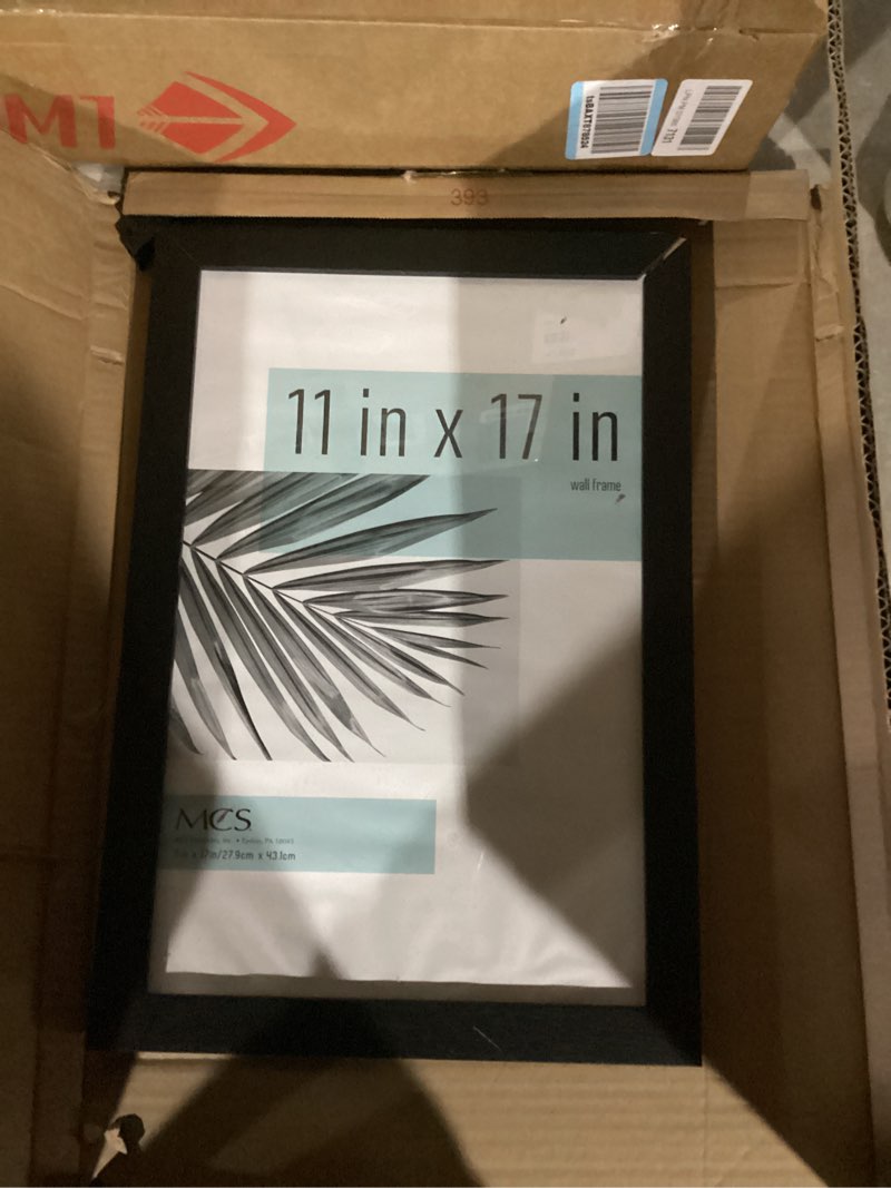 Condition photo showing Good Condition for mcs studio gallery 11x17 picture frame black woodgrain engineered wood, rectangle photo frame for photos, posters & art prints (1-pack) 1-pack black woodgrain 11x17