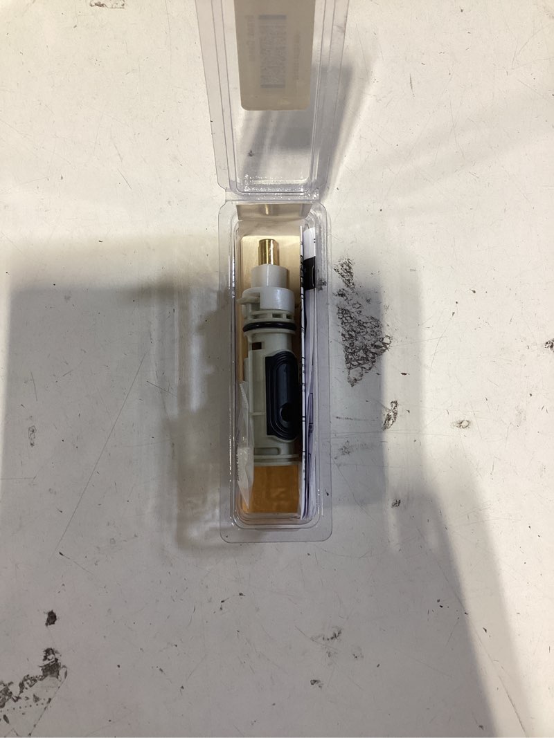 Condition photo showing As Is for danco plastic tub/shower valve cartridge for moen