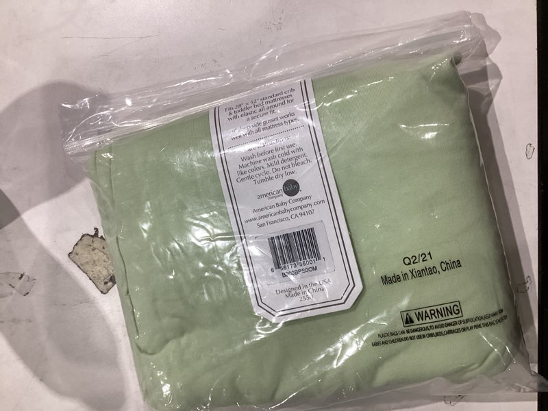 Condition photo showing item condition for American Baby Company Supreme 100% Natural Cotton Fitted Crib Sheet 52" x 28", Enhanced Thickness for Soft, Breathable & Hypoallergenic Jersey Comfort, Celery, Neutral for Boys & Girls Celery 28x52x9 Inch (Pack of 1)