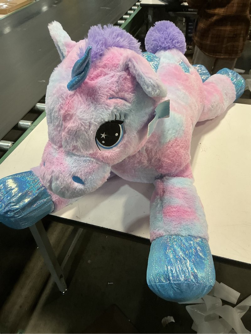 Condition photo showing Good Condition for Tezituor 43 Inch Rainbow Purple Unicorn Stuffed Animal with Wings, Giant Stuffed Unicorn Plush Toys for Girls Kids Boys Women,Soft Plushie Gifts for Valentines Day,Christmas, Birthday Party Rainbow Unicorn with Wings