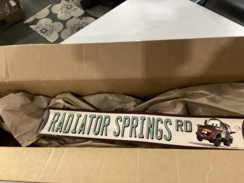 Condition photo showing New/Like New for Disney Pixar Cars Radiator Springs Road Metal Street Sign - Cars Tow Mater Sign for Garage, Kids' Bedroom or Play Room