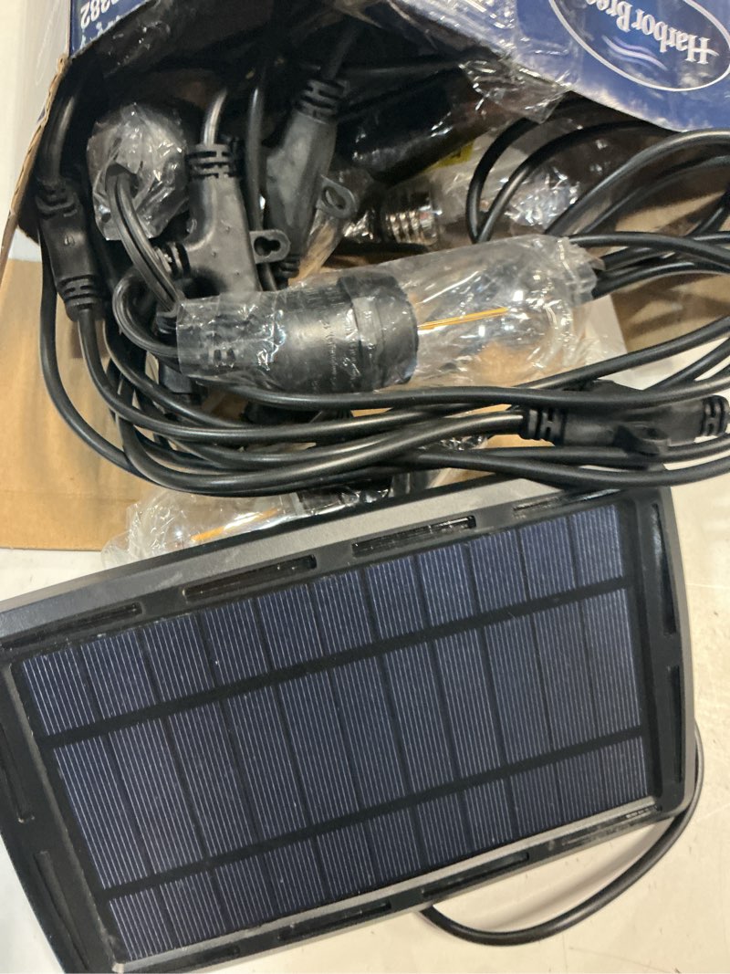 Condition photo showing As Is for harbor breeze 27-ft solar black indoor/outdoor string light with 10 white -light led edison bulbs