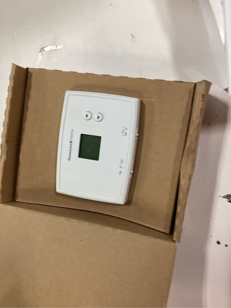 Condition photo showing As Is for honeywell home electronic non-programmable thermostat