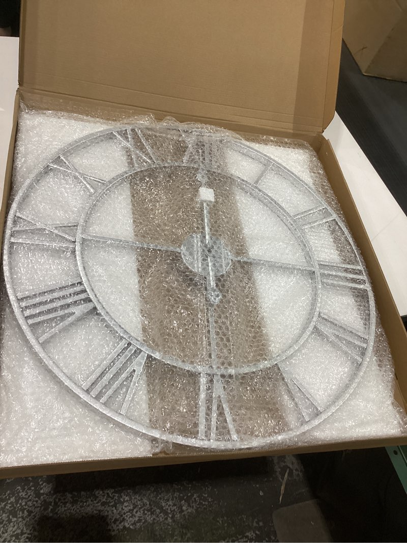 Condition photo showing Good Condition for Large Wall Clock 24 Inch Silver Roman Numerals Metal Clock Battery Operated Silent Non-Ticking Decor Clock Modern Round Oversize Wall Clocks for Home, Hotel, Office, Bedroom (Silver, 24inch) 24inch Silver
