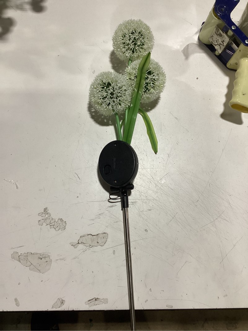 Condition photo showing As Is for solar dandelion stake
