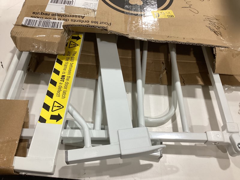 Condition photo showing As Is for regalo safety 38" baby gate for doorways & bottom of stairs, pressure mount design for babies, toddlers & pets, tested & safe for 30 years, american designed, american owned, white white 29-38.5"w x 30"h