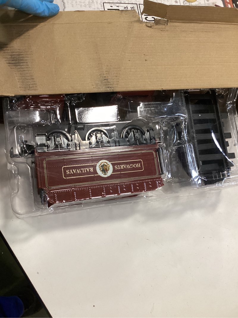 Condition photo showing As Is for Lionel Battery-Operated Hogwarts Express Toy Train Set with Bluetooth, Locomotive, Train Cars, & Track with Authentic Train Sounds, Lights, & Water Vapor Smoke Effects for Kids 4+