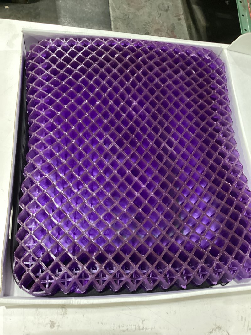 Condition photo showing New/Like New for purple back cushion | pressure reducing grid designed for ultimate comfort | designed for chairs, gaming, and travel | made in the usa