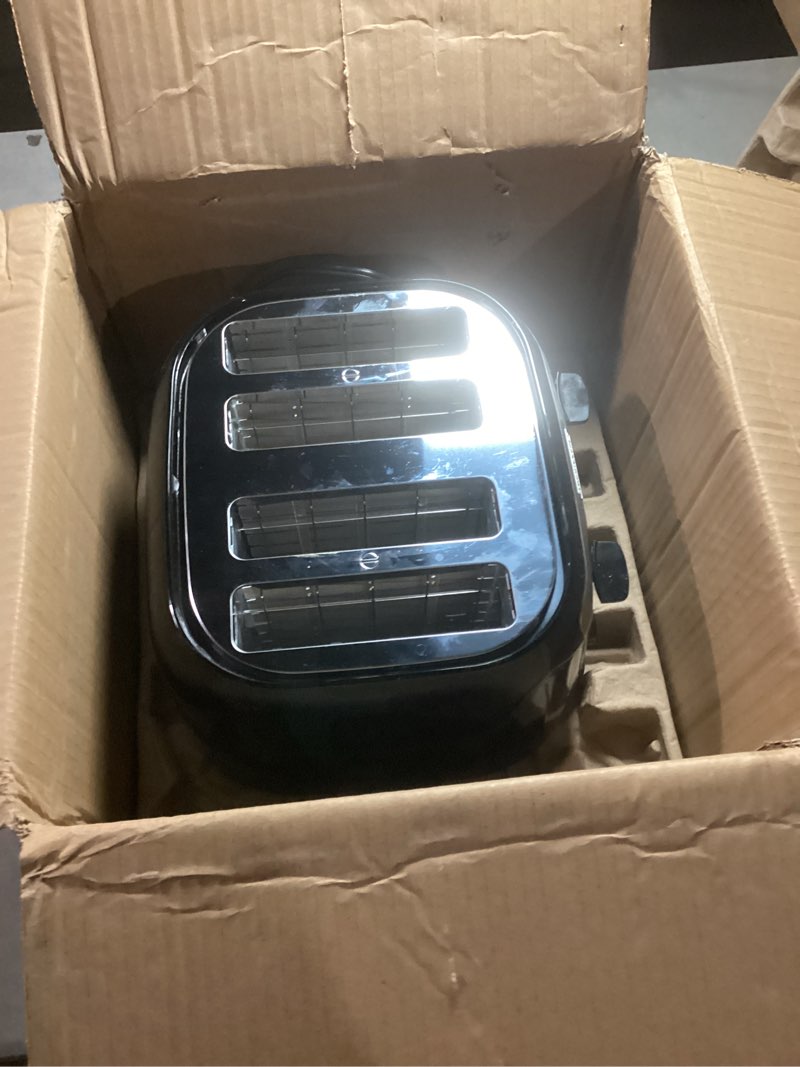 Condition photo showing As Is for black+decker 4-slice toaster, extra wide slots, 7 shade settings, 1400 watts, frozen and bagel buttons, toast shade selector, extra lift