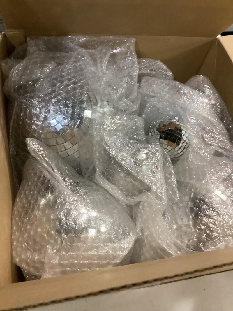 Condition photo showing Good Condition for Libima 12 Pack Large Christmas Disco Ball Decoration Different Sizes Silver Mirror Hang Disco Ball Ornaments for Christmas Tree Birthday Wedding Holiday Party Favors Prom Props(8'', 6'', 4'', 3'')