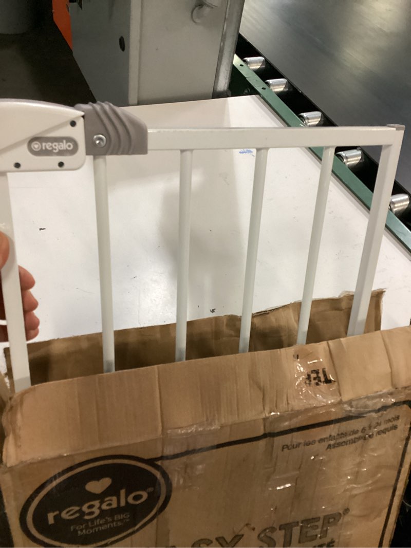 Condition photo showing As Is for regalo safety 36" extra tall baby gate for doorways & bottom of stairs, pressure mount, toddlers & pets, 6-24 months, tested & safe for 30 years, american designed, american owned white 29-36.5"w x 36"h