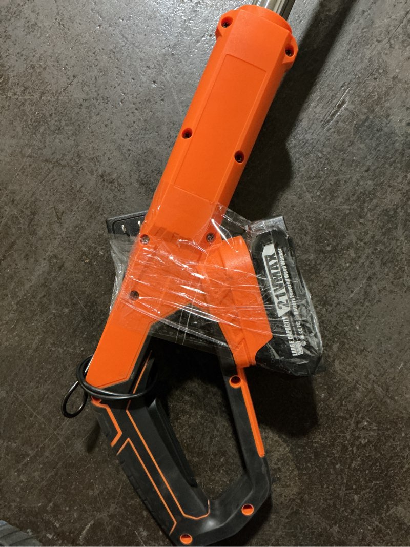 Condition photo showing As Is for black and orange 21vmax weed trimmer with battery
