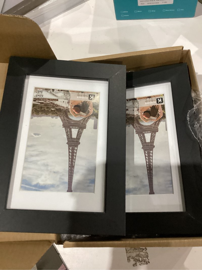 Condition photo showing Good Condition for 4x6 Picture Frame (4 Pack, Black), Made of Real Glass and Wooden Frame - Display Pictures 3.5x5 with Mat or 4x6 Without Mat, 4 by 6 Photo Frames TableTop Display and Wall Mounting Black 4x6 in