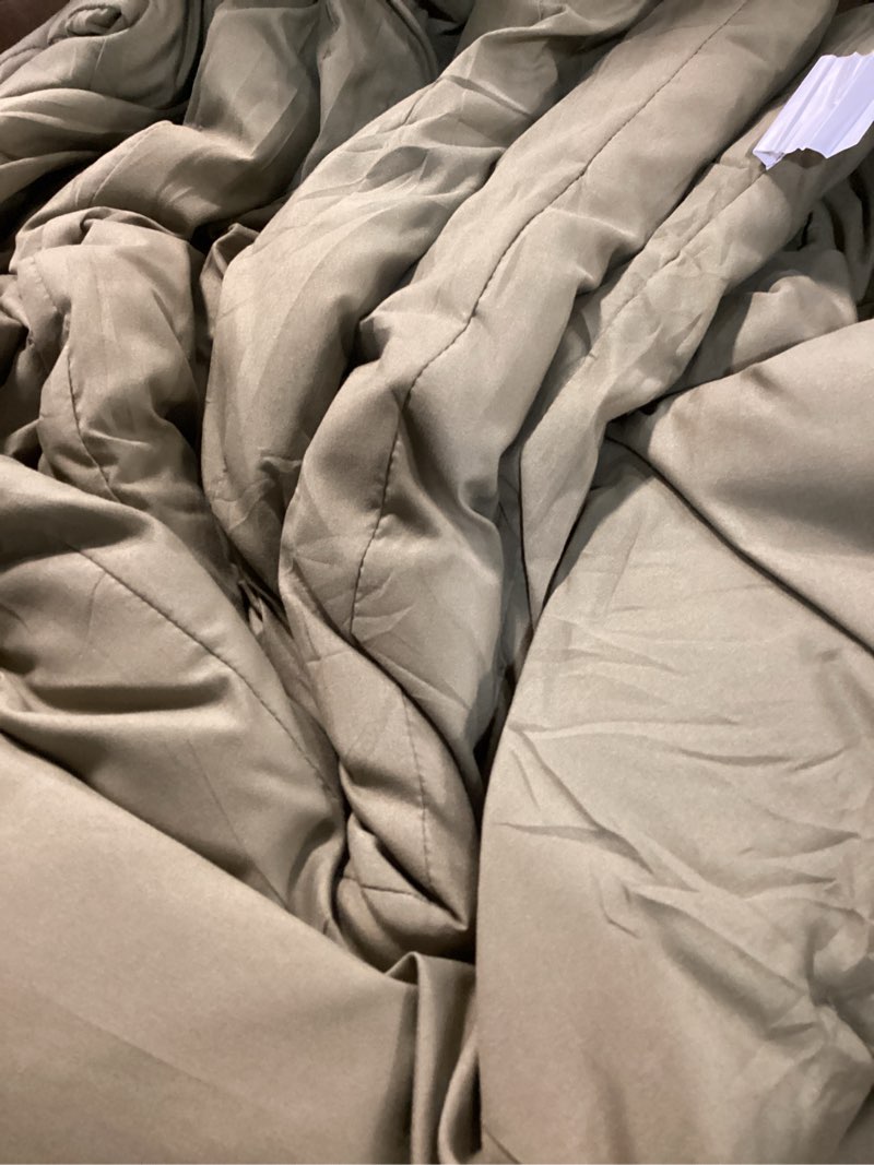 Condition photo showing As Is for dark green comforter