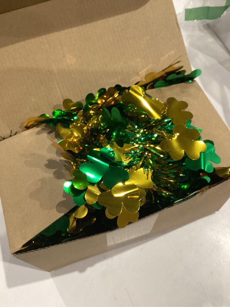 Condition photo showing Good Condition for st patrick's day tinsel garland, 50ft green shamrock tinsel garland clover tinsel twist hanging garland for outdoor indoor home tree room holiday disco party irish st patricks day decorations style 3