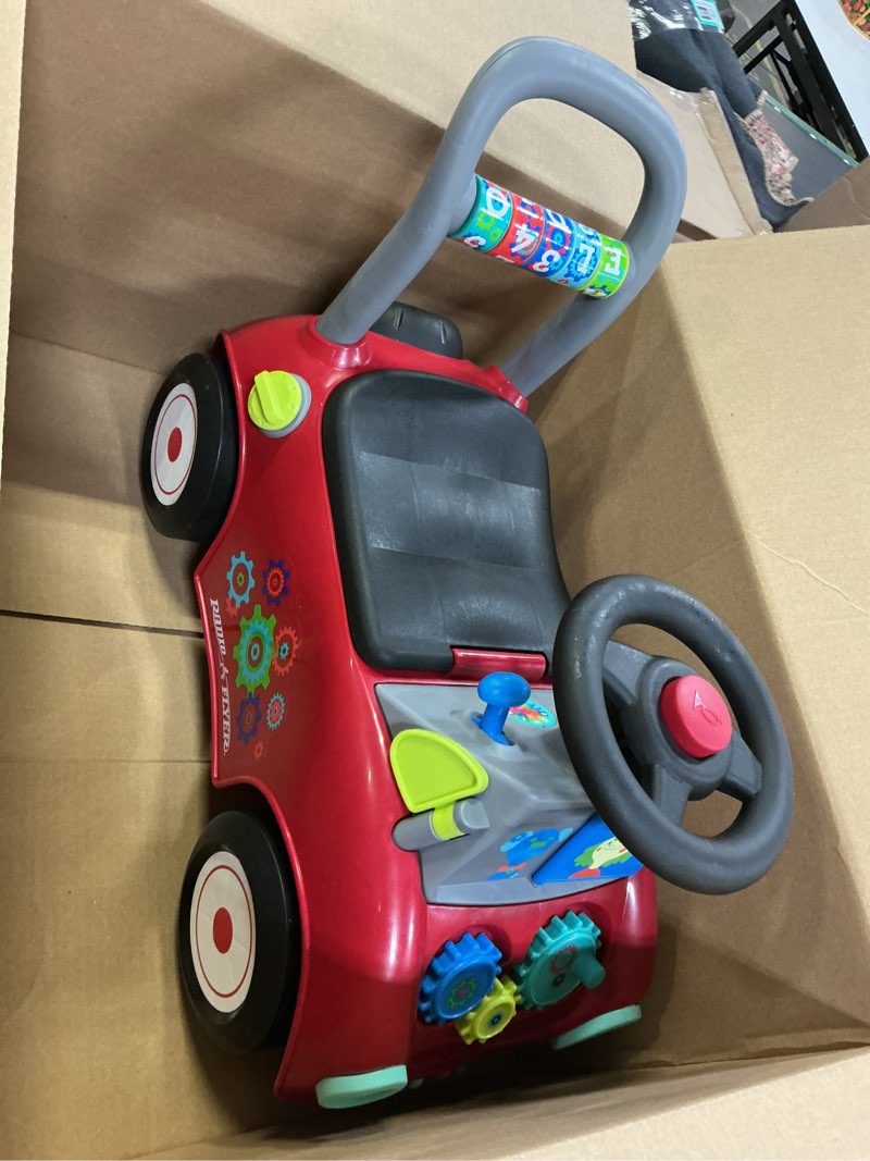 Condition photo showing As Is for Radio Flyer Busy Buggy, for Toddlers 1-3, 3-in-1 Push Walker Ride On Car with 17 Sensory Activities, Anti-Tip Feature, Under-Seat Storage, Horn and Gears, 42 lb Capacity, Toddler Ride On Toys Red