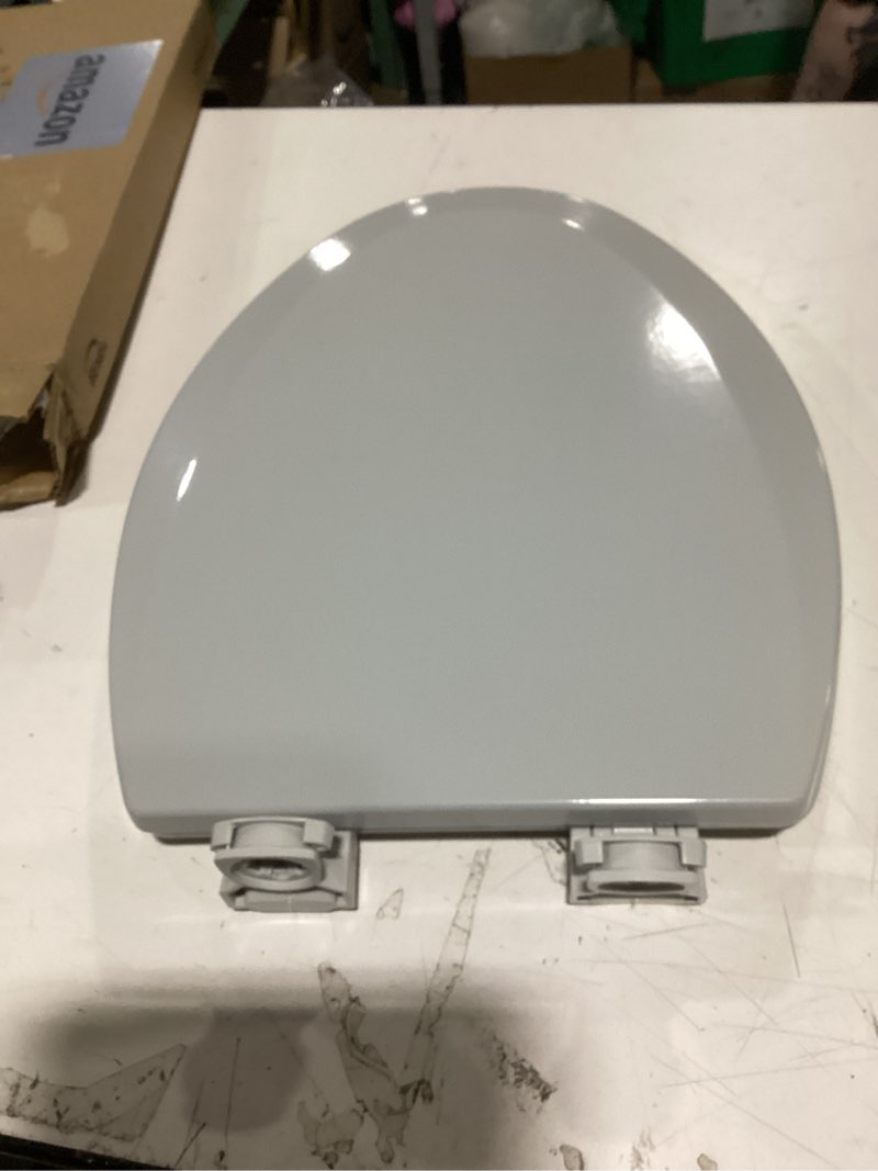 Condition photo showing New/Like New for bemis 1500ec durable wood toilet seat with easy clean hinges, made in usa, elongated, silver elongated seat