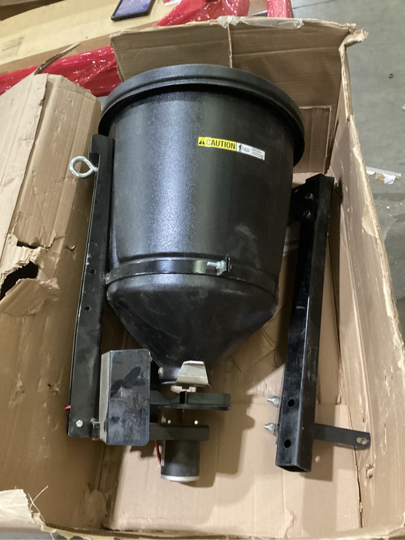 Condition photo showing As Is for buyers products utvs16 utv broadcast spreader with lid, 150 lb capacity, receiver hitch mount, for salt, grass seed, fertilizer & feed, adjustable flow gate, 12v motor, poly hopper, all season use