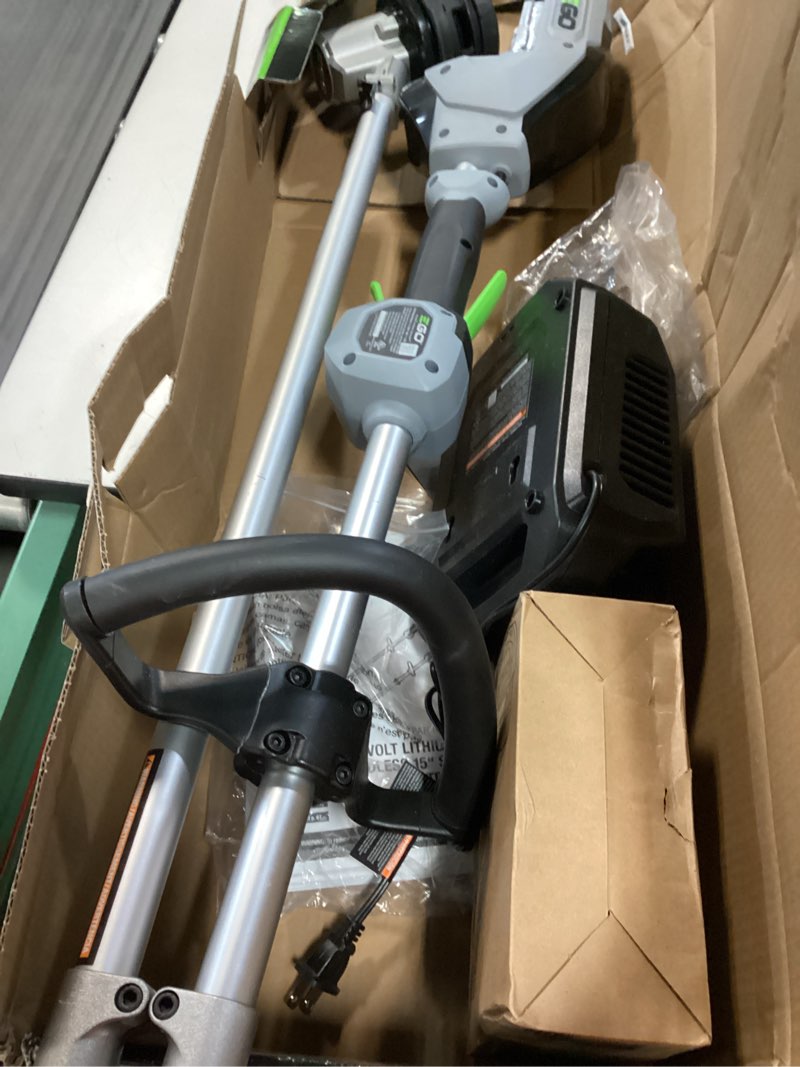 Condition photo showing As Is for ego power+ st1502sa 15 in. 56 v battery string trimmer kit (battery & charger) split shaft w/ rapid reload & 2.5 ah battery