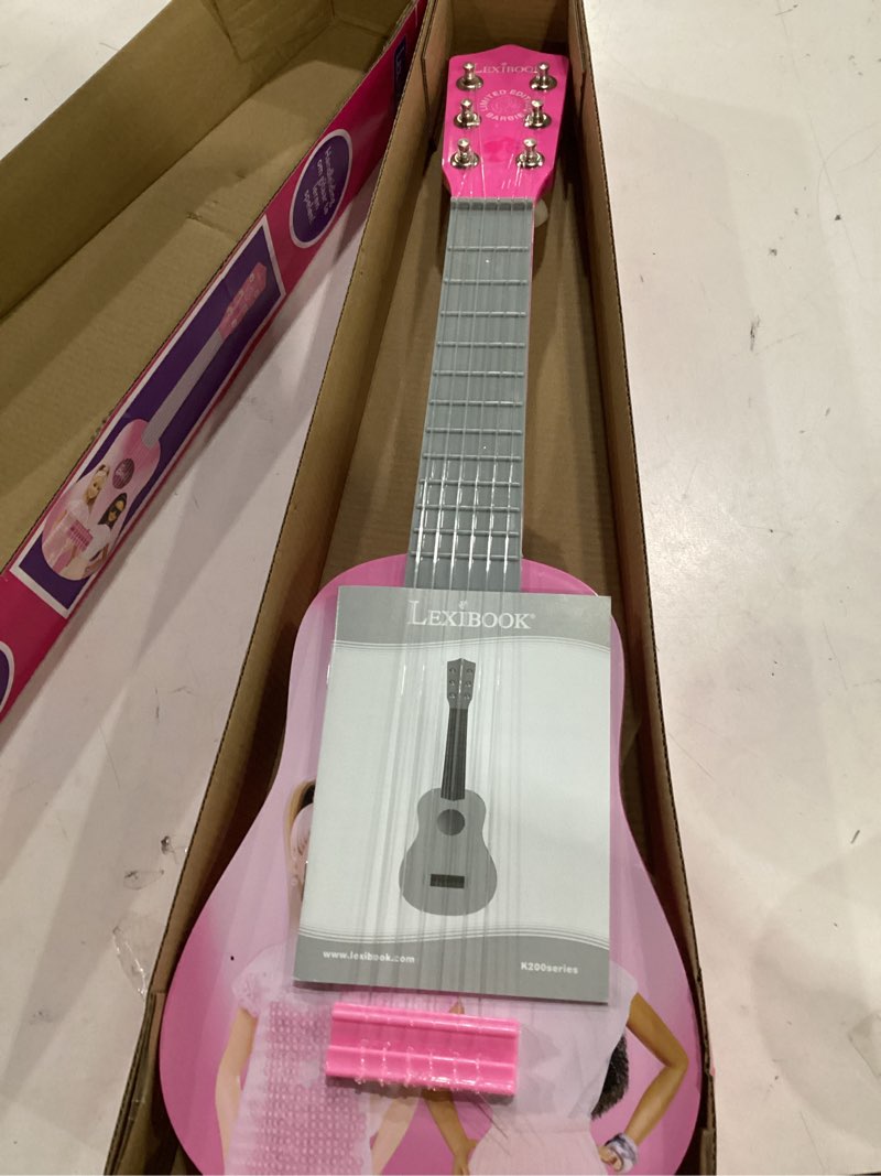Condition photo showing New/Like New for lexibook barbie, my first guitar for children, 6 nylon strings, 21’’ long, guide included, pink, k200bb