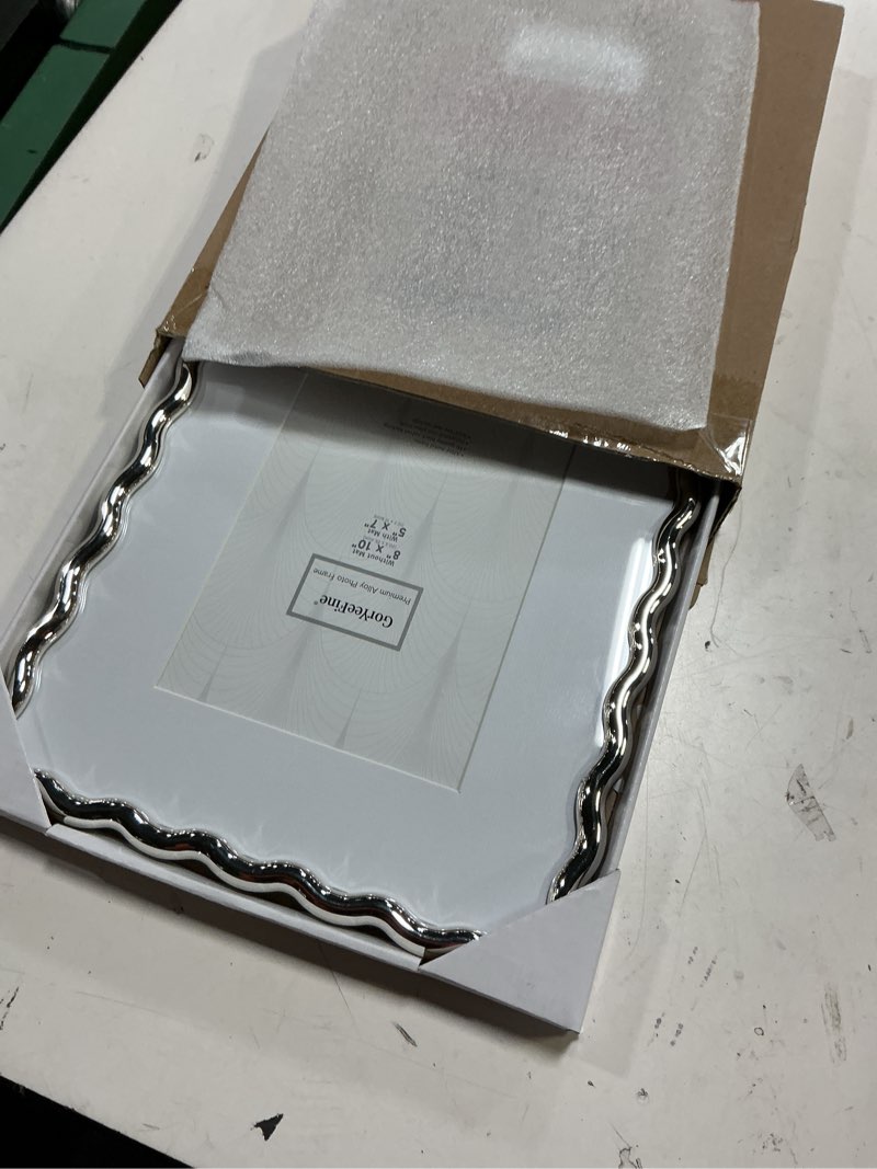 Condition photo showing Good Condition for silver 8x10'' heavy-duty zinc alloy photo frames with acid free mat for 5x7'',wave design silver picture frame 8x10'' with black velvet backing,for desktop and wall hanging 8x10''mat 5x7''(1pk) silver