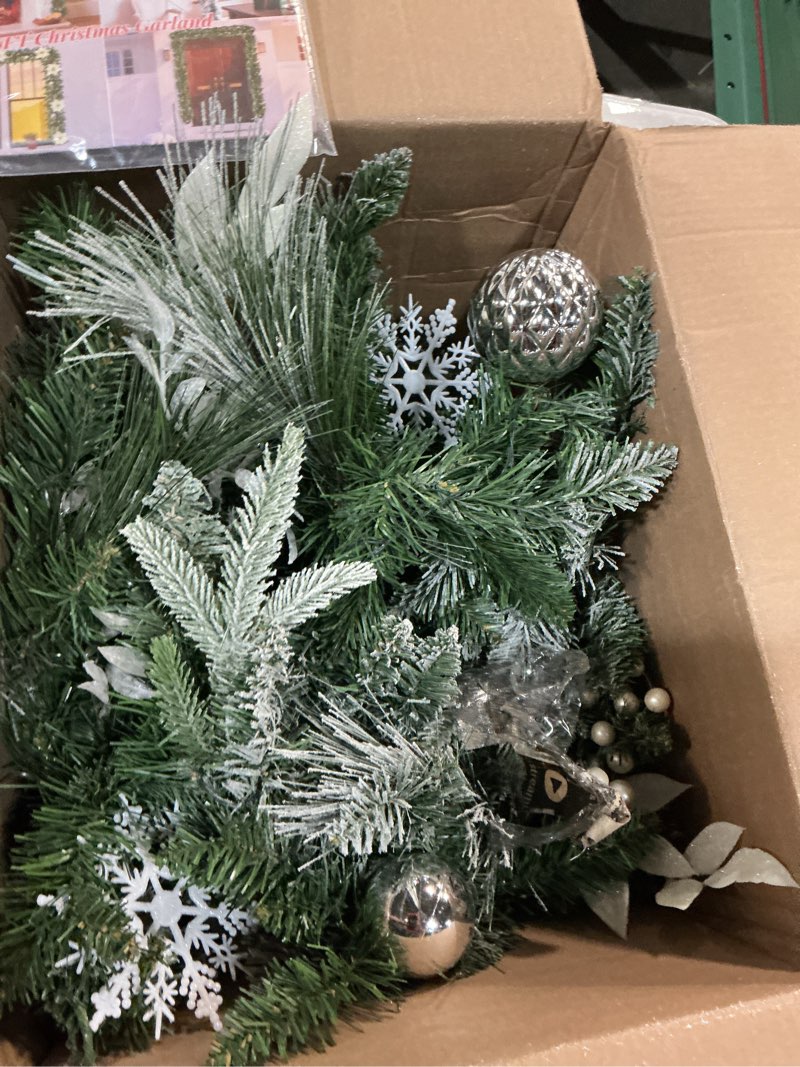 Condition photo showing As Is for christopher knight home 9-foot mixed spruce pre-lit clear led artificial christmas garland with frosted branches, red berries and pinecones, battery-operated, timer included, green