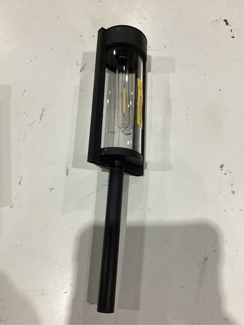 Condition photo showing As Is for lumens black solar led outdoor path light with dusk
