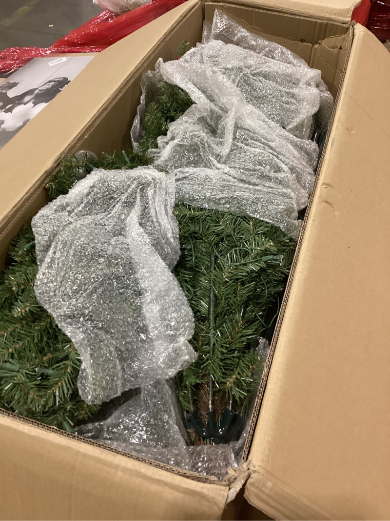 Condition photo showing As Is for Puleo International 10ft Pre-Lit Slim Fraser Christmas Tree with 800 Clear Lights, 2093 Realistic Dense Branch Tips, Easy Setup Artificial Trees with Sturdy Metal Stand 10' Slim Fraser Fir with 900 Clear Lights