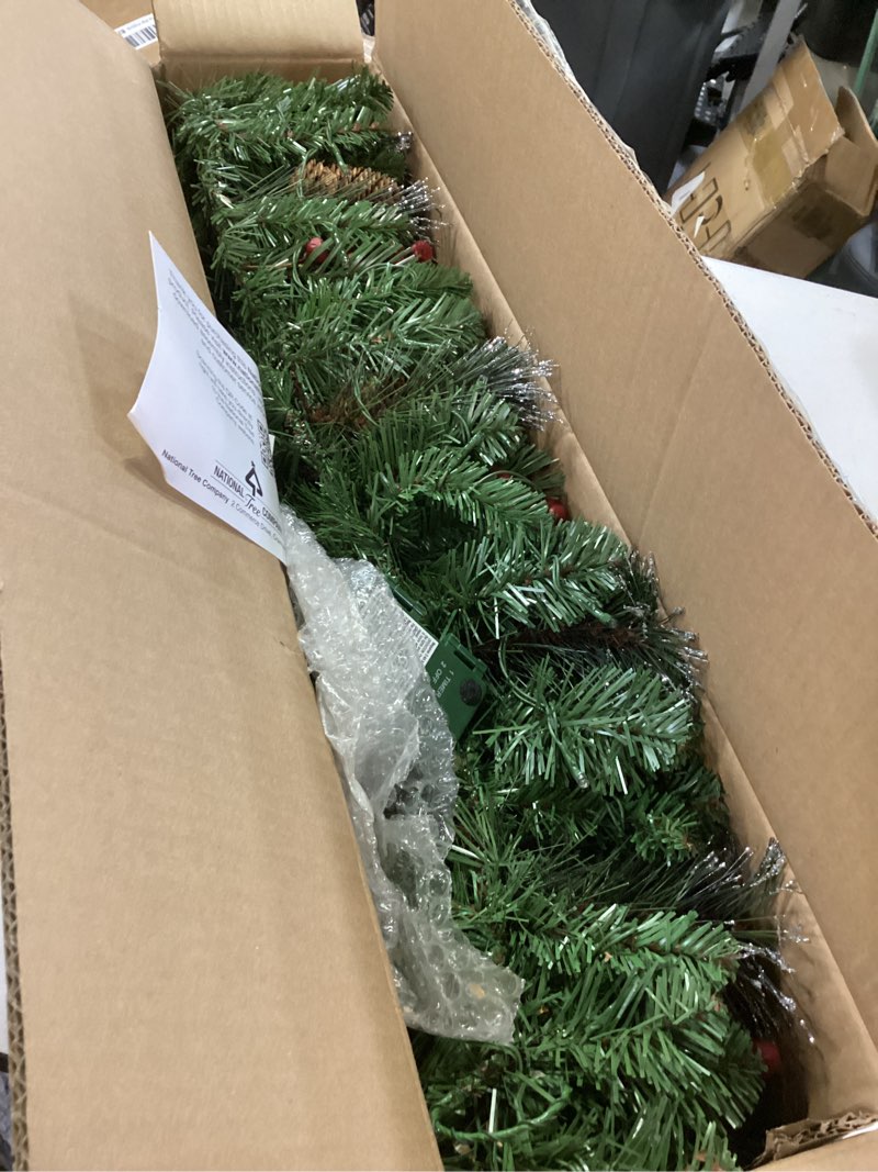 Condition photo showing Good Condition for National Tree Company 9 ft Pre-Lit Crestwood Spruce Artificial Christmas Garland, Christmas Decoration with Glitter, Pinecones, Red Berries, 50 Warm White LED Lights, 180 Tips, Timer, Green Battery Operated Tree