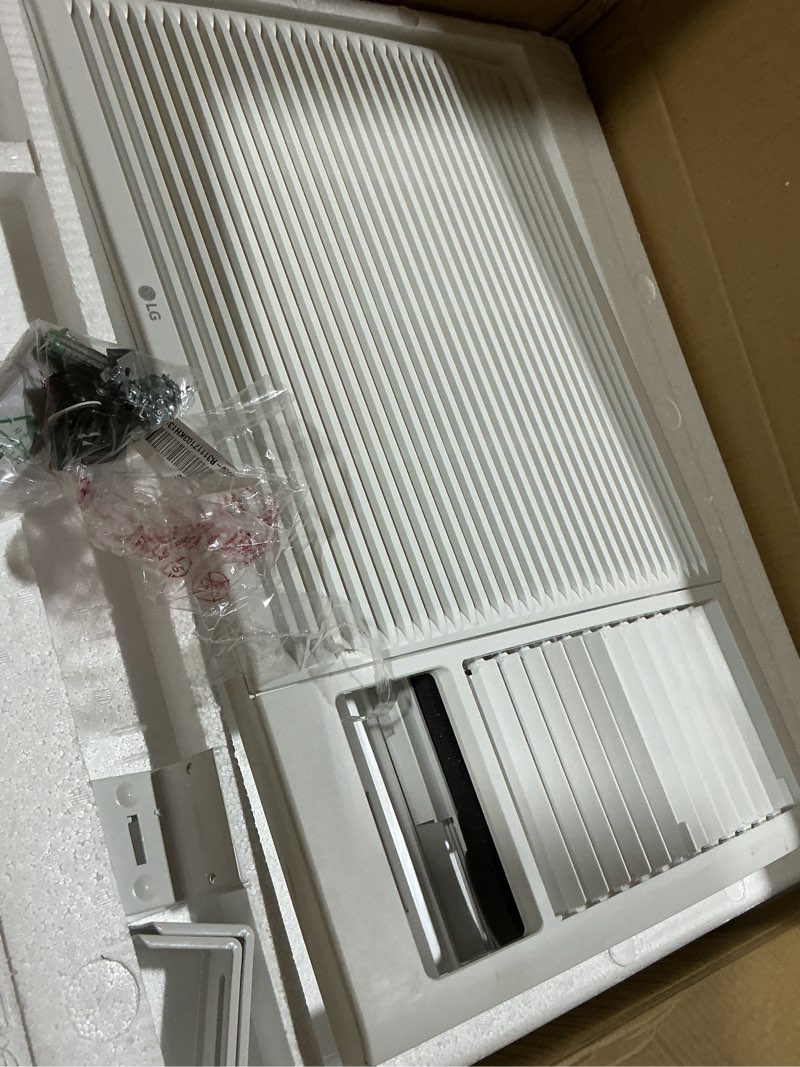 Condition photo showing As Is for 18,000 btu 230v window air conditioner cools 1000 sq. ft. with heater, remote and dehumidifier in white