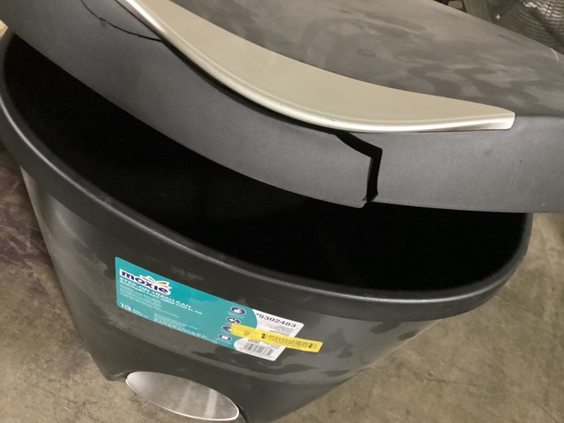Condition photo showing As Is for moxie 13-gallon black plastic indoor kitchen step trash can