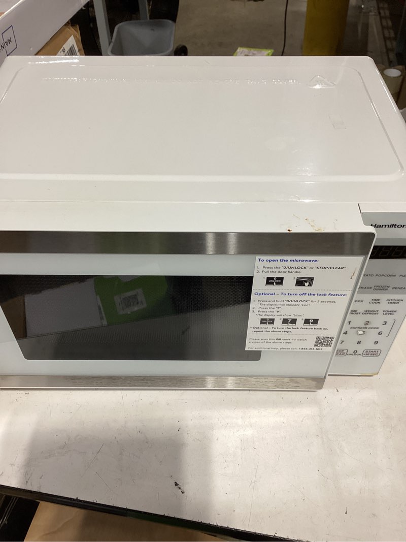 Condition photo showing As Is for hamilton beach microwave oven 0.9 cu ft 900w white stainless steel