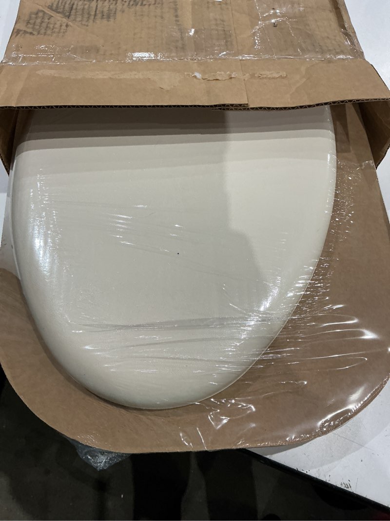 Condition photo showing New/Like New for mayfair padded toilet seat, cushioned soft vinyl over wood core seat, secure hinges, easy clean, made in usa, elongated, bone round bone toilet seat