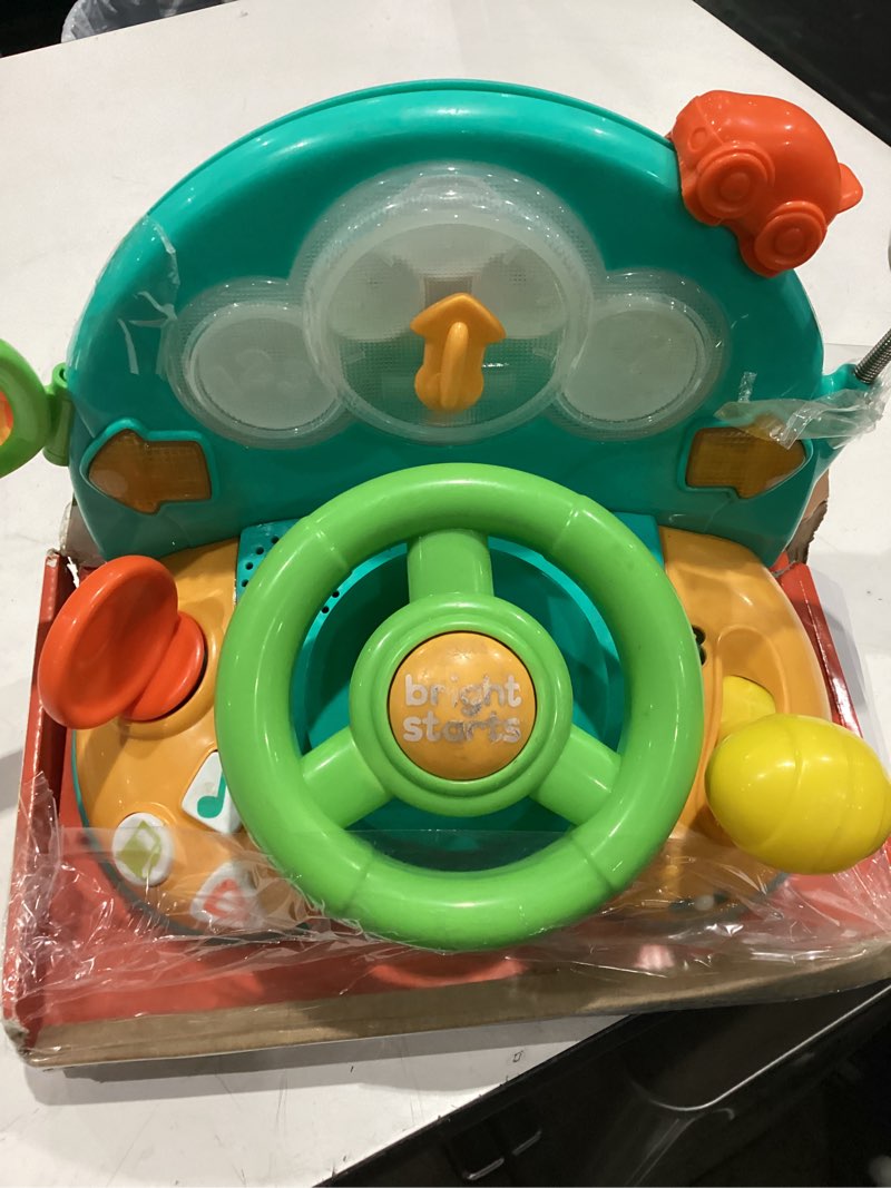Condition photo showing As Is for bright starts lights & colors driver steering wheel baby toy