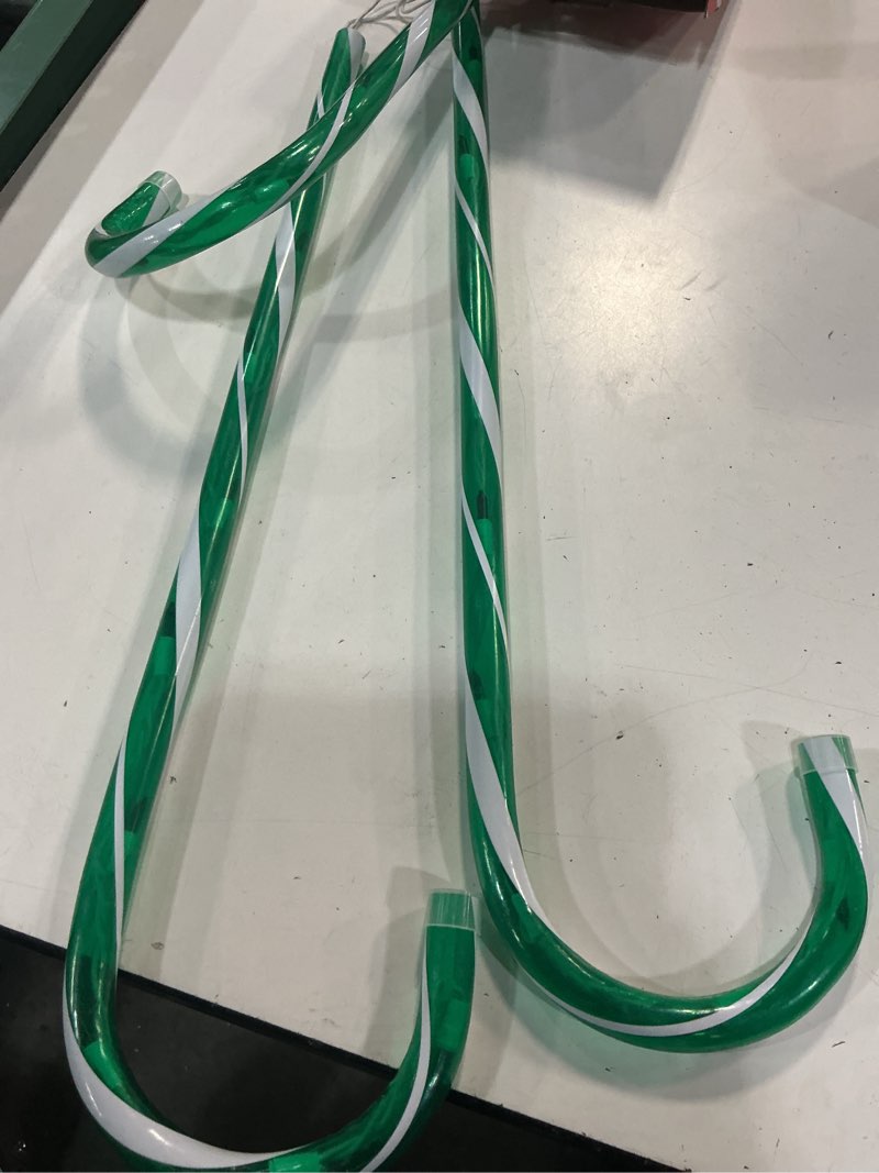 Condition photo showing As Is for ultimate unicorn 10\\\" christmas candy cane lights (6pcs) for landscape decoration, outdoor pathway makers lights, candy cane walkway lights green(include stakes) green inch