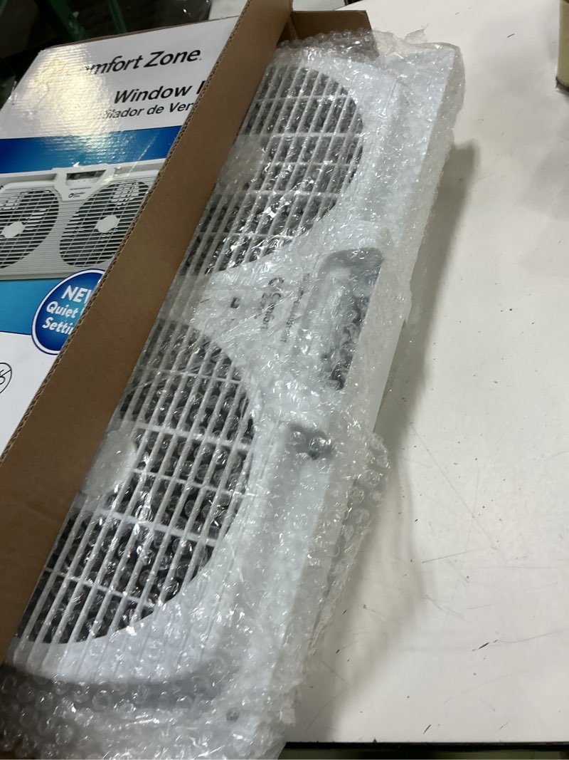 Condition photo showing Good Condition for comfort zone 9  twin window fan with quiet setting  reversible airflow control  3-speeds  expandable  exhaust  dual fan  airflow 9.84 ft/sec  ideal for home  kitchen  bedroom & office  cz319wt2