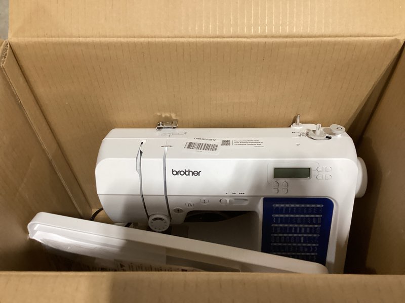 Condition photo showing As Is for brother cs7000x computerized sewing and quilting machine, 70 built-in stitches, lcd display, wide table, 10 included feet, white