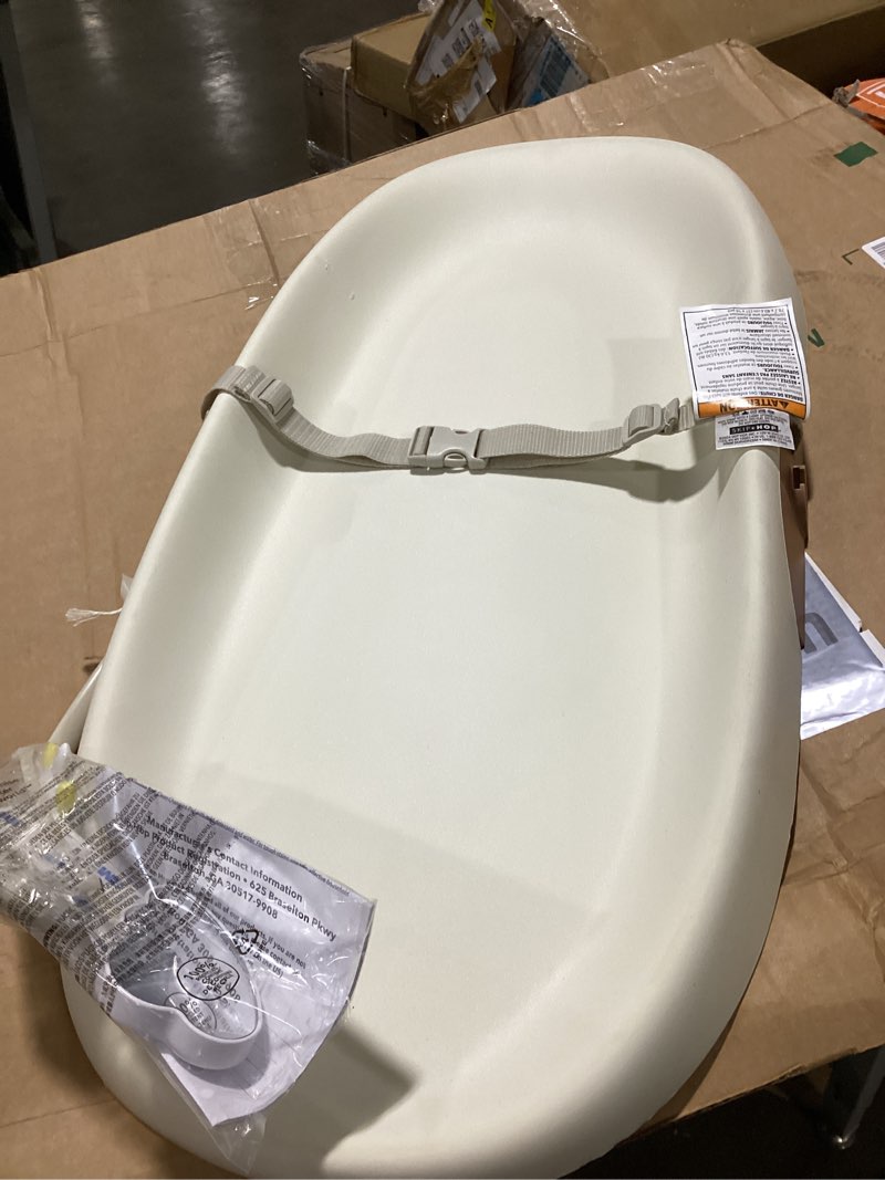 Condition photo showing As Is for skip hop baby changing pad nursery style wipe-clean contoured with cushioned foam, non-skid base, built-in safety belt & tuck-away toy bar fits standard changing tables, oat 16" oat