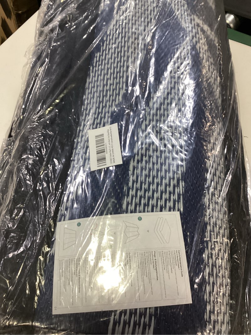 Condition photo showing Good Condition for genimo outdoor rug for patio clearance,9'x12' waterproof large mat,reversible plastic camping rugs,rv,porch,deck,camper,balcony,backyard (navy blue & white)
