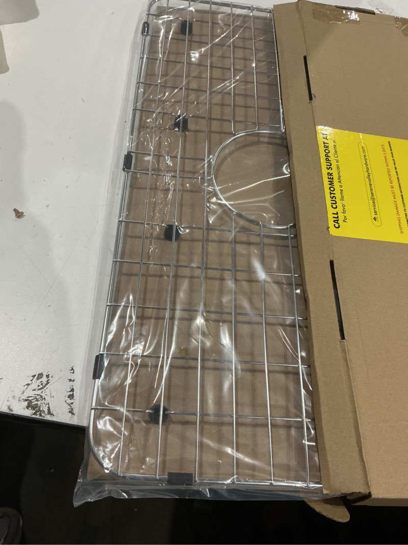 Condition photo showing Good Condition for serene valley sink bottom grid 24-1/8" x 12-5/8", centered drain with corner radius 1-1/2", sink protector nlw2412c