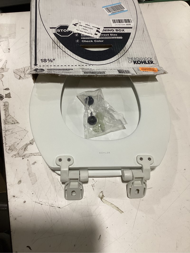 Condition photo showing Good Condition for kohler stonewood quiet-close elongated toilet seat, slow close design, durable wood, easy installation, universal fit, white finish, k-20466-0