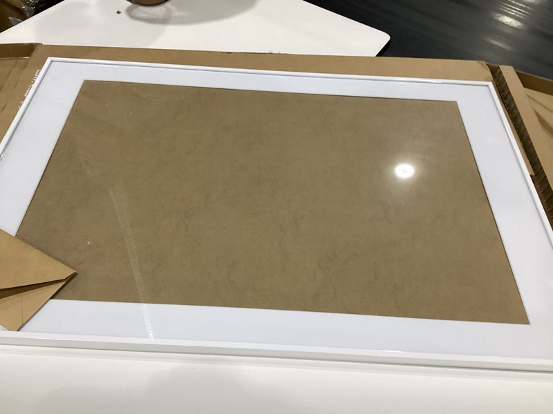 Condition photo showing Good Condition for americanflat 24x36 poster frame with polished plexiglass - white picture frame - wide photo frames made of engineered wood for vertical or horizontal wall display - epic collection - white white 24x36, similar to stock photo