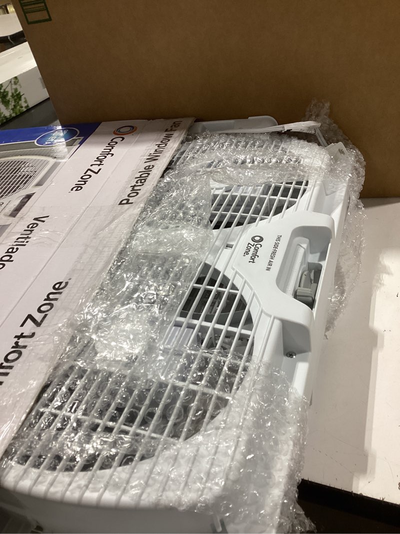 Condition photo showing Good Condition for Comfort Zone 9  Twin Window Fan with Reversible Airflow Control  Auto-Locking Expanders  2 Speed Fan  Dual Fan  Exhaust  Airflow 9.84 ft/sec  Ideal for Home  Kitchen  Bedroom & Office  CZ319WT