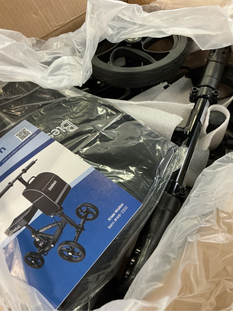Condition photo showing Good Condition for steerable knee walker deluxe medical scooter for foot injuries compact crutches, with dual rear on-wheel brake and shock absorption under the knee pad, black