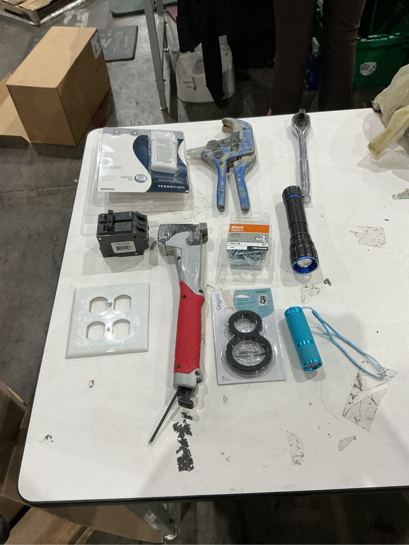 Condition photo showing As Is for assorted home improvement lot (small tools, screw, home accessories, etc.)