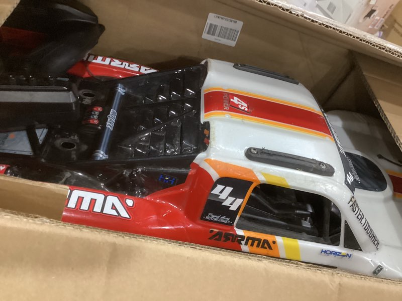 Condition photo showing As Is for arrma mojave rc truck 4x4 4s blx 1/8th scale desert truck rtr (battery and charger not included), white/red ara4404t1