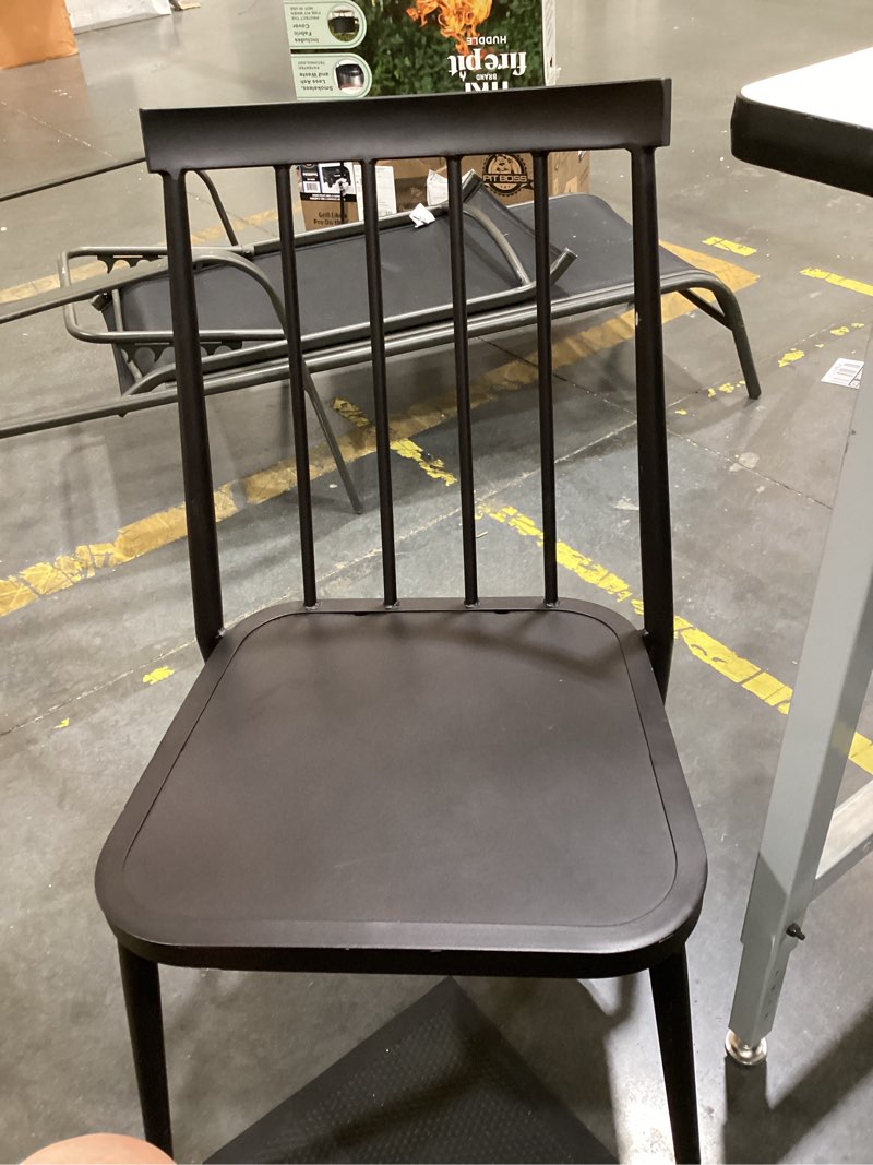 Condition photo showing As Is for windsor armless patio dining stacking chair black -