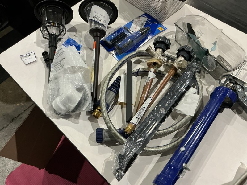 Condition photo showing As Is for assorted home improvement lot (small tools, screw, home accessories, etc.)