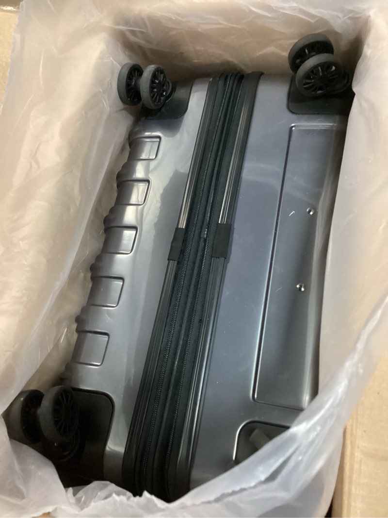 Condition photo showing As Is for DELSEY PARIS Helium Aero Hardside Expandable Luggage with Spinner Wheels, Titanium, Checked-Large 28 Inch Titanium Checked-Large 28 Inch